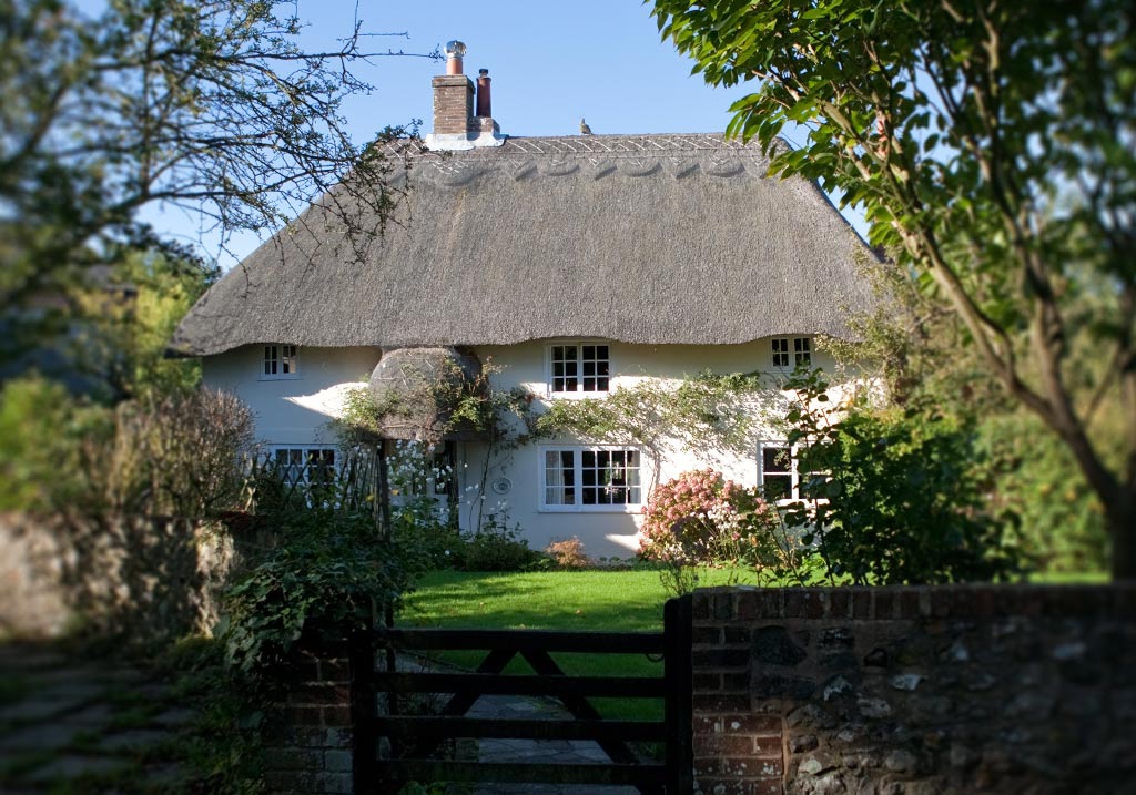 Heritage home with thatched roof, ideal application for secondary glazing